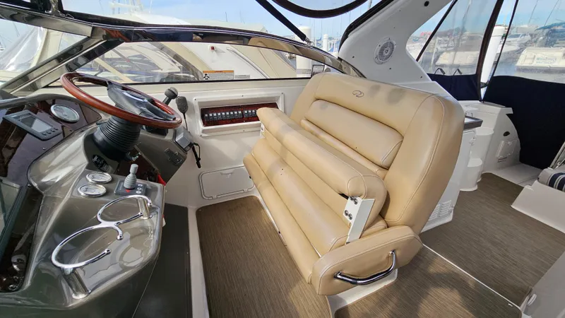  Yacht Photos Pics Interior of 2007 Regal 3760 Commodore yacht with beige seating and steering wheel.