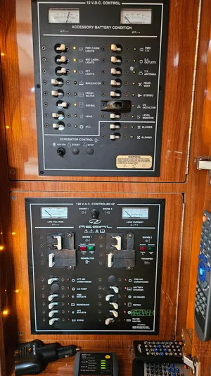  Yacht Photos Pics Control panel of a 2007 Regal 3760 Commodore boat with various switches and meters.