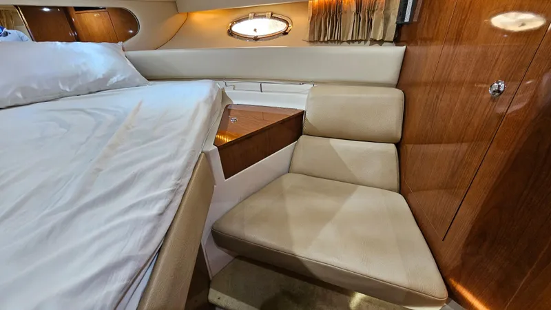 Yacht Photos Pics Luxurious interior of 2007 Regal 3760 Commodore yacht with bed and seating area.