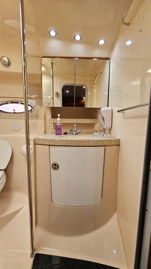  Yacht Photos Pics 2007 Regal 3760 Commodore yacht bathroom with sink, mirror, and modern fixtures.