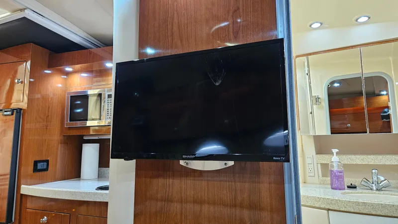  Yacht Photos Pics 2007 Regal 3760 Commodore interior with TV, microwave, and sink.