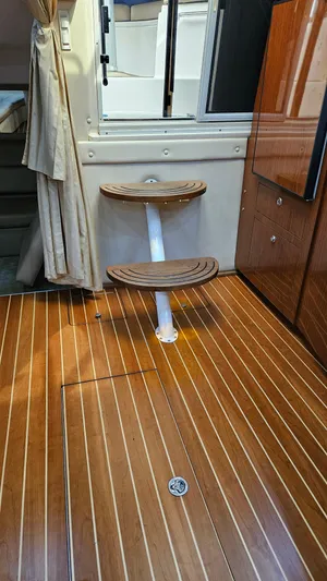  Yacht Photos Pics Interior of 2007 Regal 3760 Commodore with wooden flooring and compact steps.