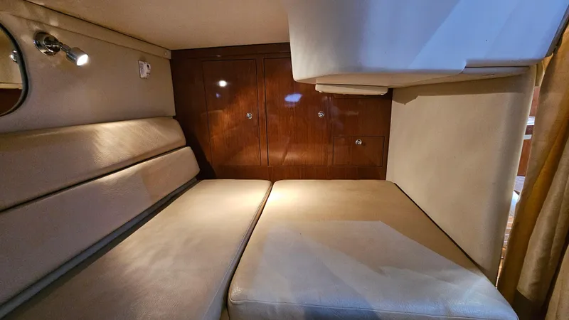  Yacht Photos Pics 2007 Regal 3760 Commodore cabin interior with beige seating and wooden cabinetry.