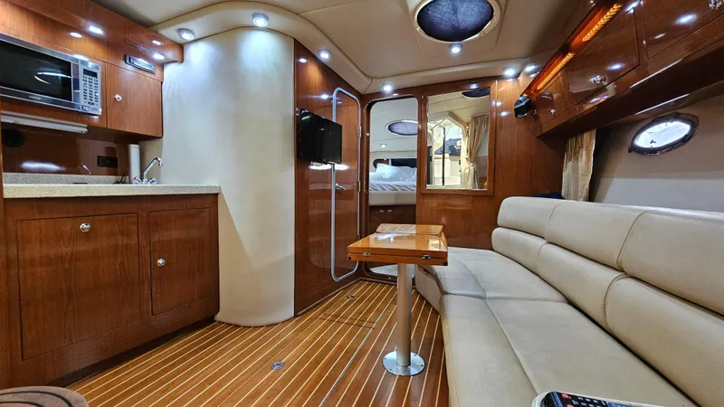  Yacht Photos Pics Luxurious interior of 2007 Regal 3760 Commodore yacht with wood finishes and modern amenities.
