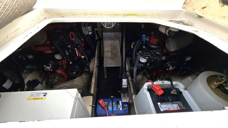  Yacht Photos Pics Engine compartment of 2007 Regal 3760 Commodore boat, showing batteries and mechanical components.