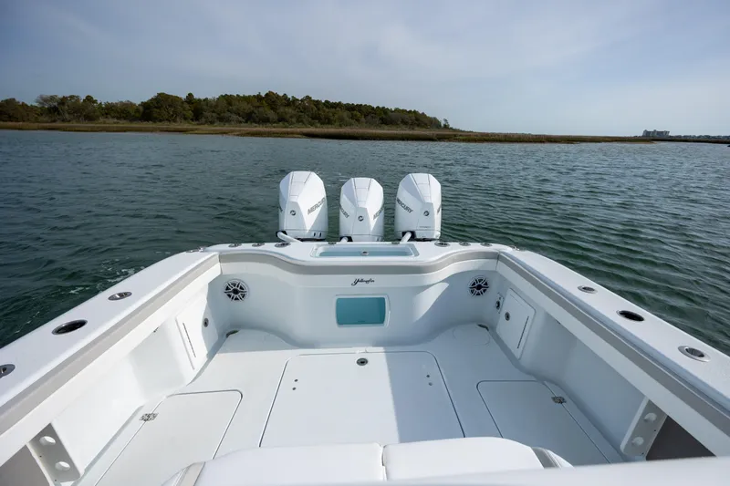  Yacht Photos Pics 2025 Yellowfin 34 Offshore boat with triple Mercury engines on calm water.