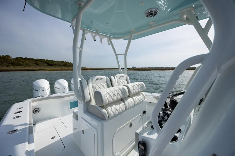  Yacht Photos Pics 2025 Yellowfin 34 Offshore boat interior with luxurious seating and triple Mercury engines.