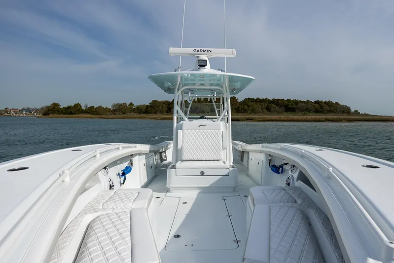  Yacht Photos Pics 2025 Yellowfin 34 Offshore boat on calm water, featuring sleek design and advanced navigation.