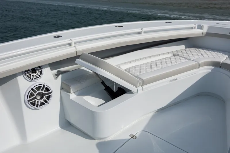  Yacht Photos Pics 2025 Yellowfin 34 Offshore boat interior with cushioned seating and built-in speakers.