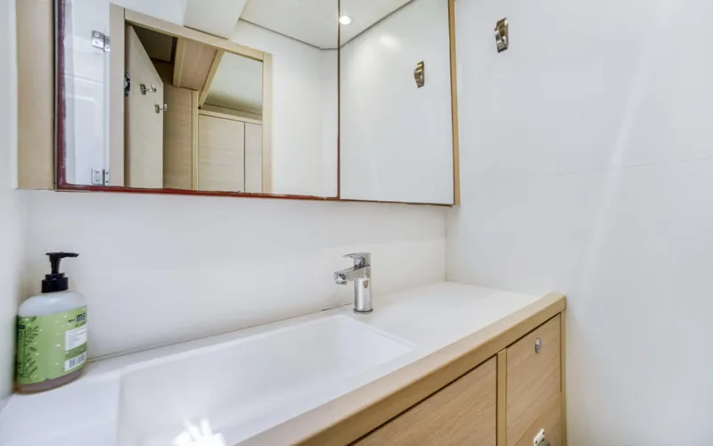 Dream Beauty Yacht Photos Pics Modern bathroom interior on 2020 Lagoon 620 yacht with sleek sink and mirror.