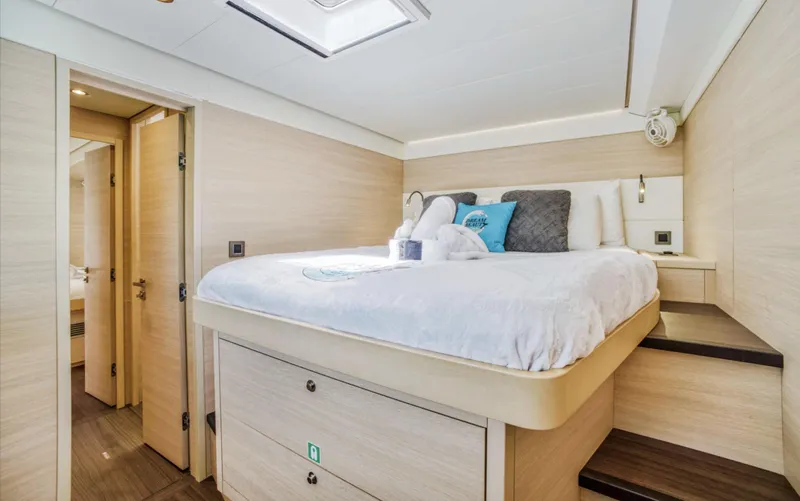 Dream Beauty Yacht Photos Pics Luxurious bedroom interior of 2020 Lagoon 620 yacht with modern design and cozy bedding.