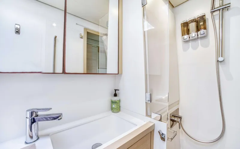 Dream Beauty Yacht Photos Pics Modern bathroom in 2020 Lagoon 620 yacht with sleek fixtures and shower amenities.