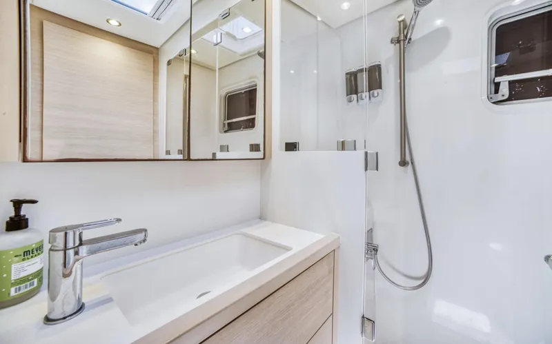 Dream Beauty Yacht Photos Pics Modern bathroom in 2020 Lagoon 620 yacht with sleek fixtures and natural lighting.