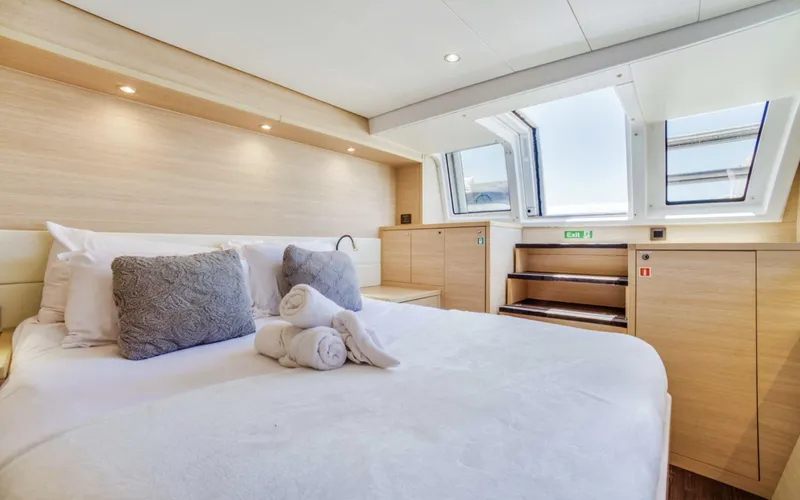 Dream Beauty Yacht Photos Pics Luxurious bedroom interior of 2020 Lagoon 620 yacht with skylight and modern decor.