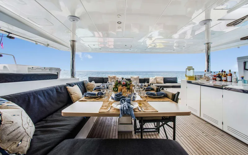 Dream Beauty Yacht Photos Pics Luxurious Lagoon 620 yacht dining area with elegant table setting, ocean view, and modern amenities.