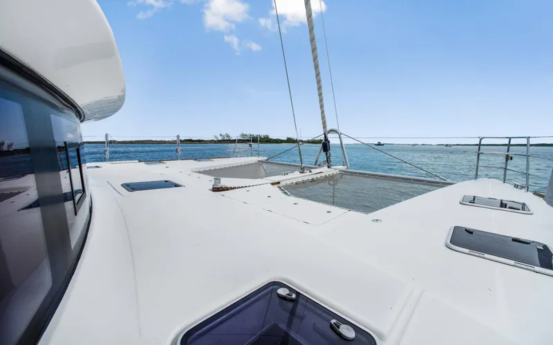 Dream Beauty Yacht Photos Pics Lagoon 620 catamaran deck view, sailing on clear blue waters, 2020 model.