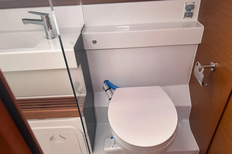 Yours To Name Yacht Photos Pics 2026 Jeanneau 440 Sun Odyssey yacht bathroom with modern fixtures and compact design.
