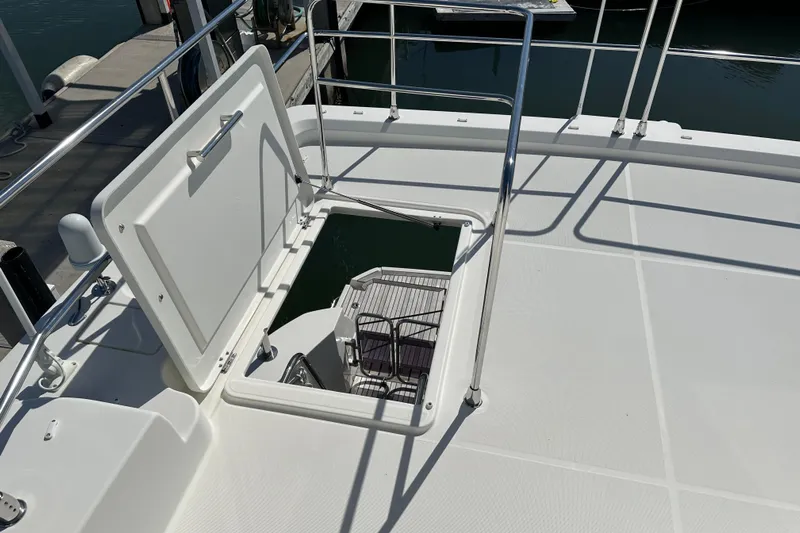 Mer Sea Yacht Photos Pics 2021 Beneteau Swift Trawler 41 Fly deck hatch open, revealing interior stairs.