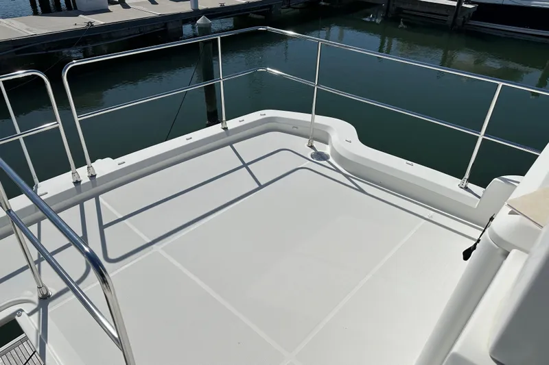 Mer Sea Yacht Photos Pics Flybridge deck of 2021 Beneteau Swift Trawler 41 Fly, featuring sleek railings.