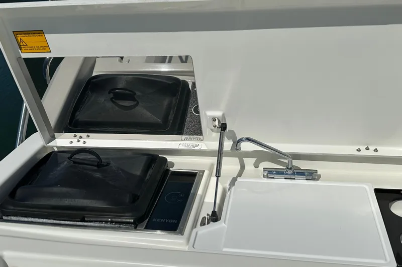 Mer Sea Yacht Photos Pics Outdoor kitchen on 2021 Beneteau Swift Trawler 41 Fly with stove and sink.