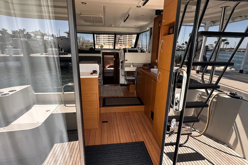 Mer Sea Yacht Photos Pics Interior view of 2021 Beneteau Swift Trawler 41 Fly, showcasing modern design and wood finishes.