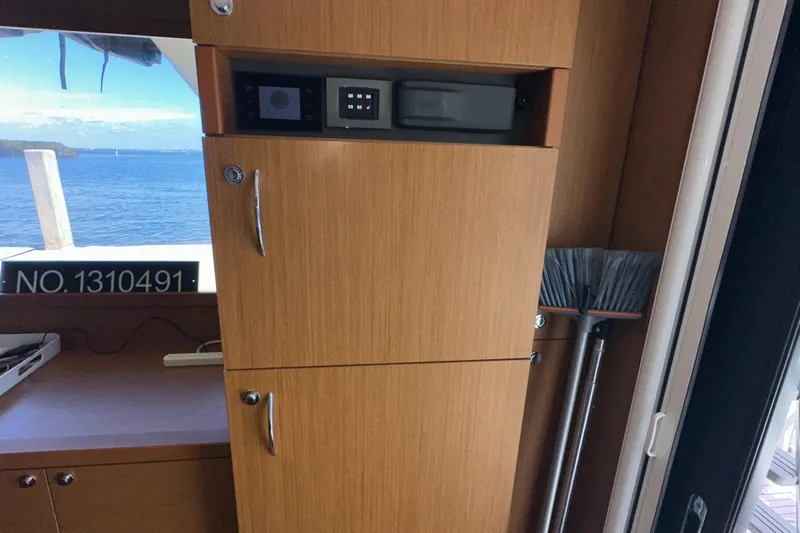 Mer Sea Yacht Photos Pics Interior of 2021 Beneteau Swift Trawler 41 Fly with wooden cabinetry and ocean view.