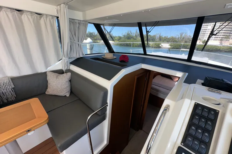 Mer Sea Yacht Photos Pics Interior of 2021 Beneteau Swift Trawler 41 Fly, featuring seating and helm controls.