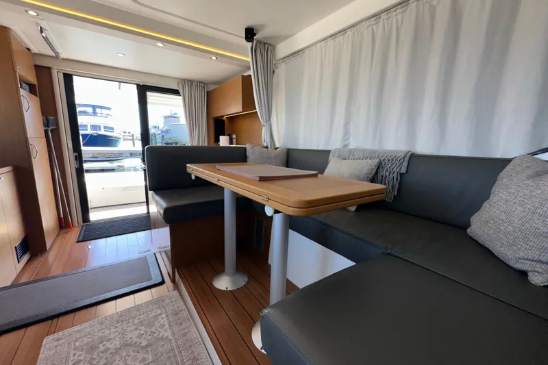 Mer Sea Yacht Photos Pics Interior of 2021 Beneteau Swift Trawler 41 Fly with modern seating and table.