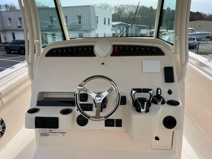 Yacht Photos Pics 2025 Grady-White Canyon 336 boat dashboard with steering wheel and controls.