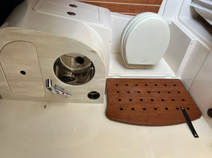  Yacht Photos Pics 2025 Grady-White Canyon 336 boat interior with sink and cutting board.