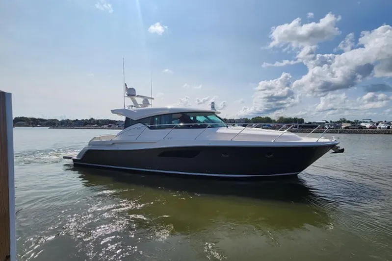 Strange Magic II Yacht Photos Pics 2018 Tiara 44 Coupe yacht cruising on a sunny day.
