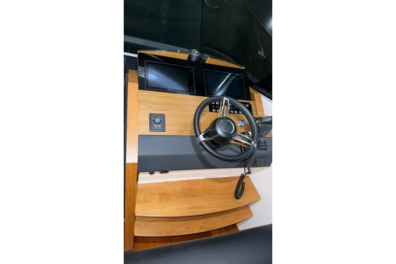 Strange Magic II Yacht Photos Pics Helm of 2018 Tiara Yachts C44 Coupe with dual screens and wooden accents.