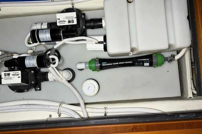 Strange Magic II Yacht Photos Pics 2018 Tiara Yachts C44 Coupe plumbing system with vacuum pump and holding tank vent filter.