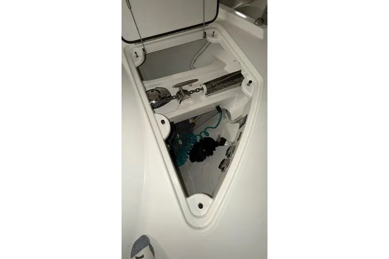 Strange Magic II Yacht Photos Pics Anchor compartment of 2018 Tiara Yachts C44 Coupe, showcasing storage and equipment.