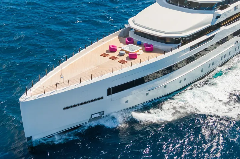 Rio Yacht Photos Pics Luxurious 2022 CRN 62m yacht cruising with stylish deck seating and jacuzzi.