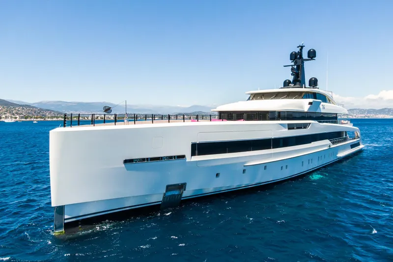 Rio Yacht Photos Pics Luxurious 2022 CRN 62m yacht cruising in clear blue waters.