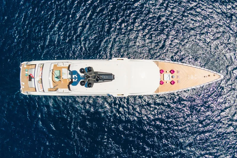 Rio Yacht Photos Pics Aerial view of 2022 CRN 62m yacht on deep blue ocean waters.