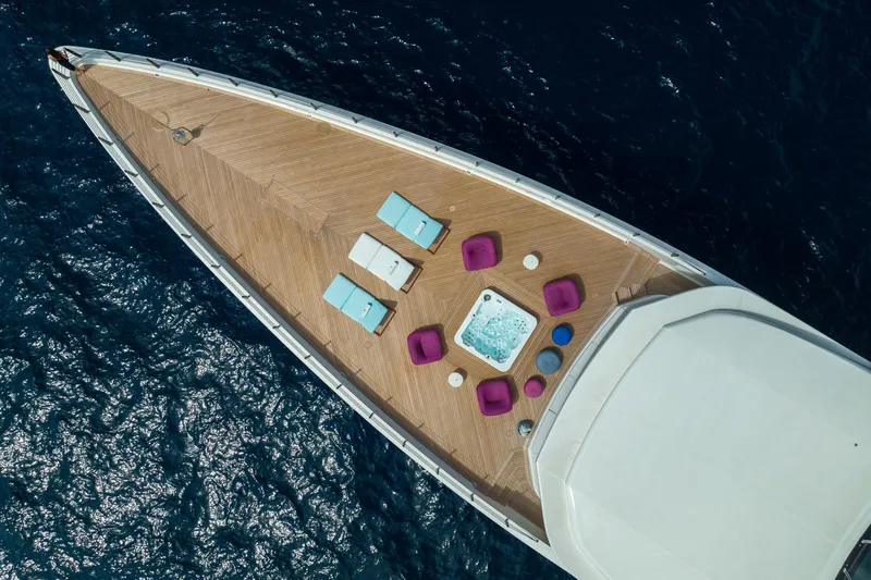 Rio Yacht Photos Pics Aerial view of luxurious 2022 CRN 62m yacht deck with jacuzzi and seating.