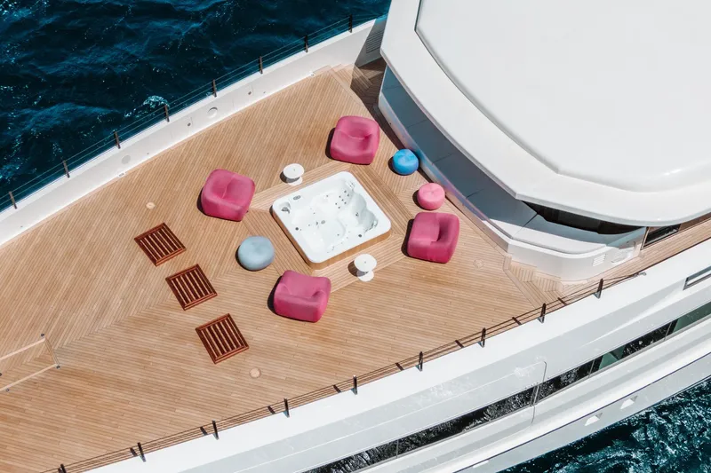 Rio Yacht Photos Pics Luxurious CRN 62m yacht deck with jacuzzi and colorful seating, 2022 model.