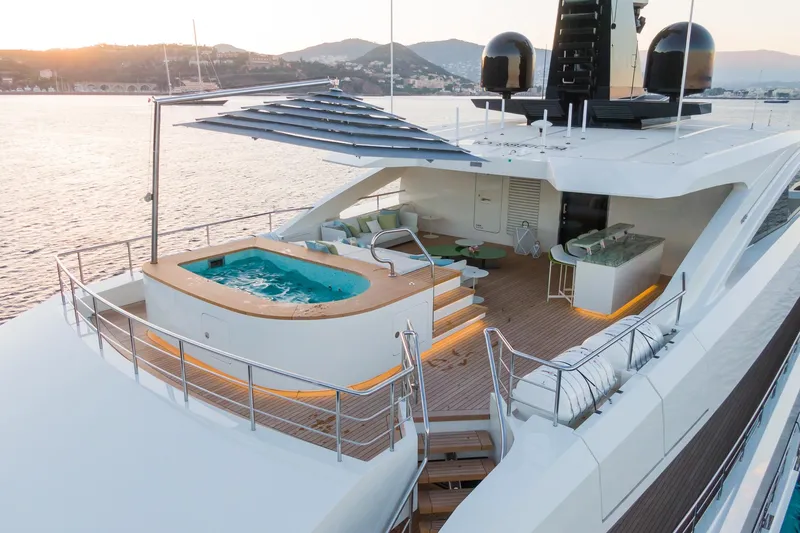 Rio Yacht Photos Pics Luxurious 2022 CRN 62m yacht with jacuzzi and elegant deck overlooking serene waters.