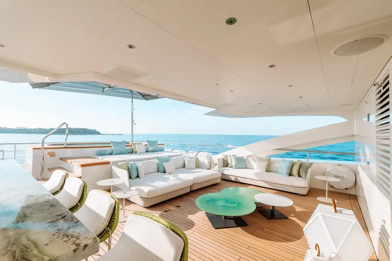 Rio Yacht Photos Pics Luxurious 2022 CRN 62m yacht deck with elegant seating and ocean view.