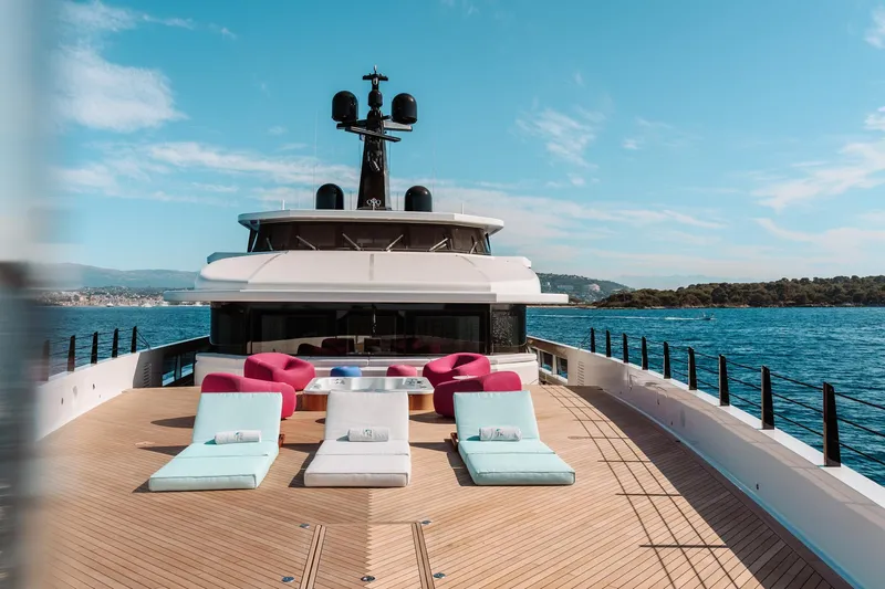 Rio Yacht Photos Pics Luxurious 2022 CRN 62m yacht deck with sun loungers and ocean view.