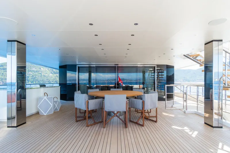 Rio Yacht Photos Pics Luxurious 2022 CRN 62m yacht deck with elegant seating and scenic ocean views.