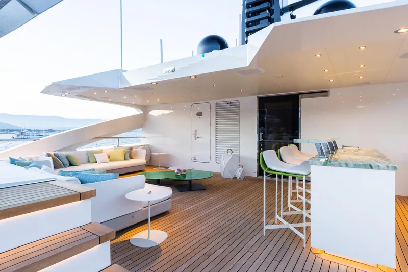 Rio Yacht Photos Pics Luxurious 2022 CRN 62m yacht deck with modern seating and bar area.