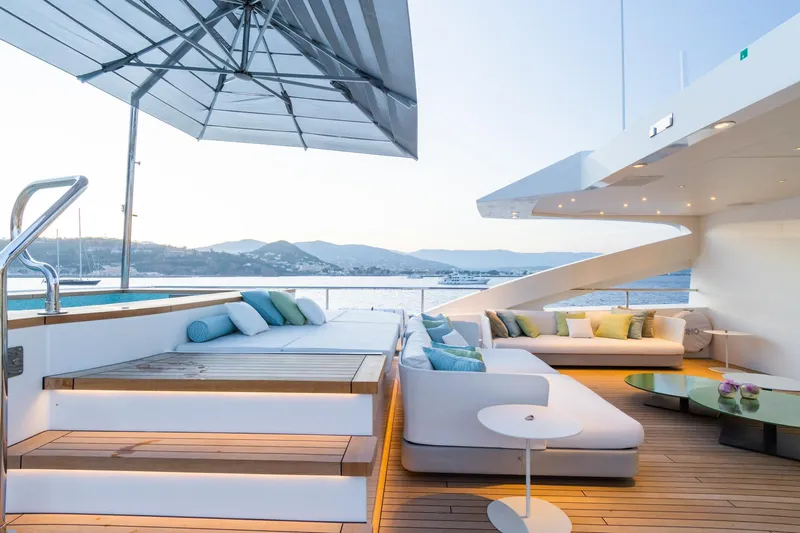 Rio Yacht Photos Pics Luxurious 2022 CRN 62m yacht deck with modern seating and ocean view.