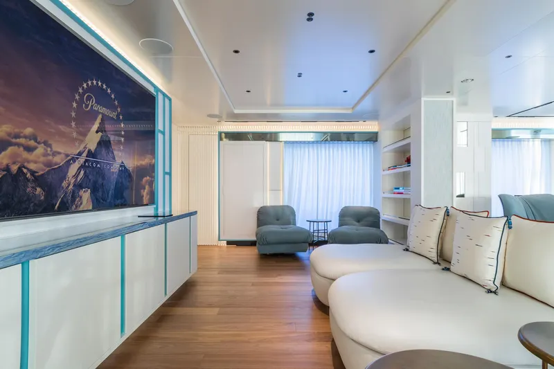 Rio Yacht Photos Pics Luxurious interior of 2022 CRN 62m yacht with modern seating and large screen.