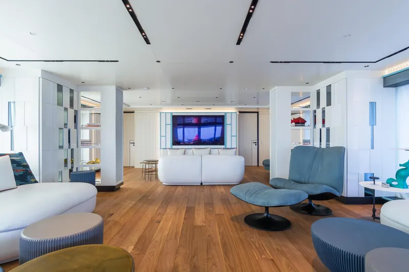 Rio Yacht Photos Pics Luxurious yacht interior with modern furnishings, wooden flooring, and elegant decor, CRN 62m, 2022 model.