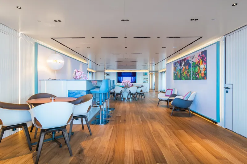 Rio Yacht Photos Pics Luxurious 2022 CRN 62m yacht interior with modern decor, vibrant artwork, and elegant seating.