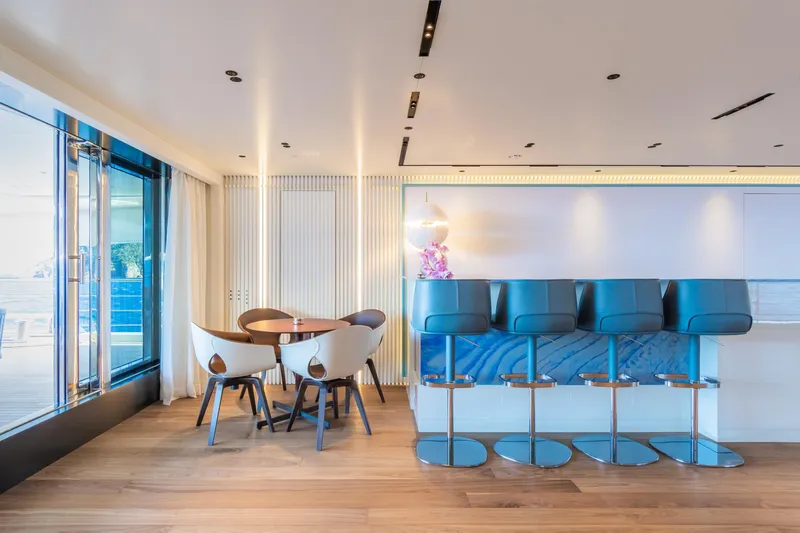 Rio Yacht Photos Pics Luxurious interior of 2022 CRN 62m yacht with modern bar and seating area.