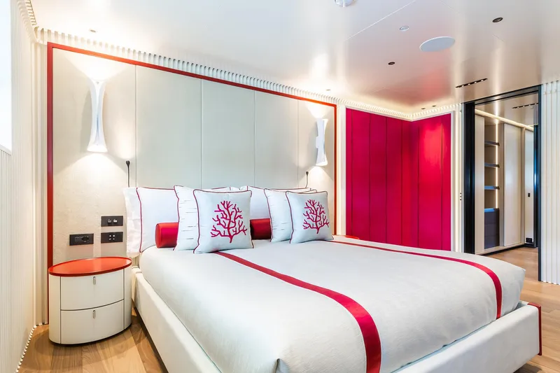Rio Yacht Photos Pics Luxurious CRN 62m yacht bedroom, 2022 model, featuring elegant red and white decor.